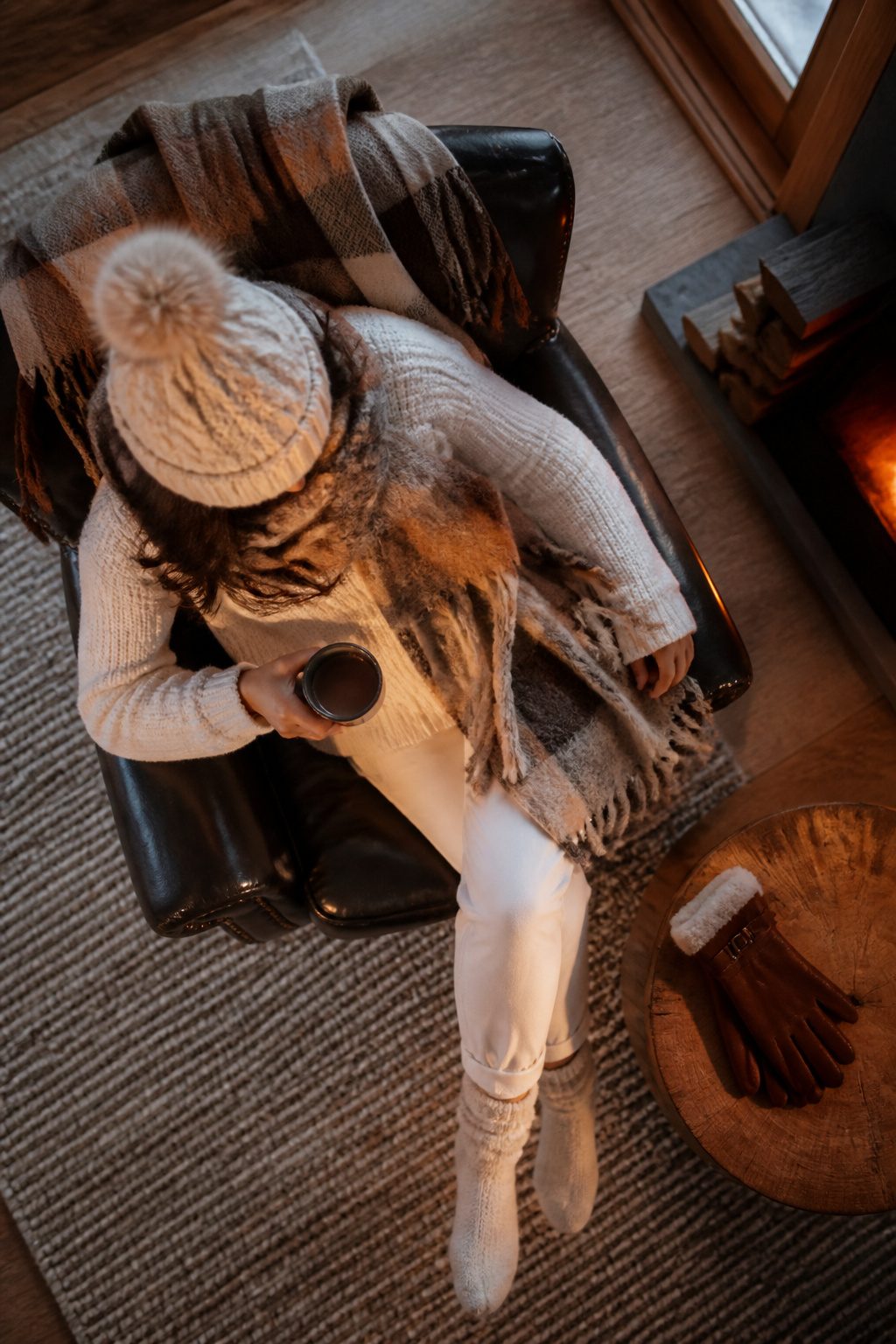 Accessories including beanie and scarf complement a winter outfit.