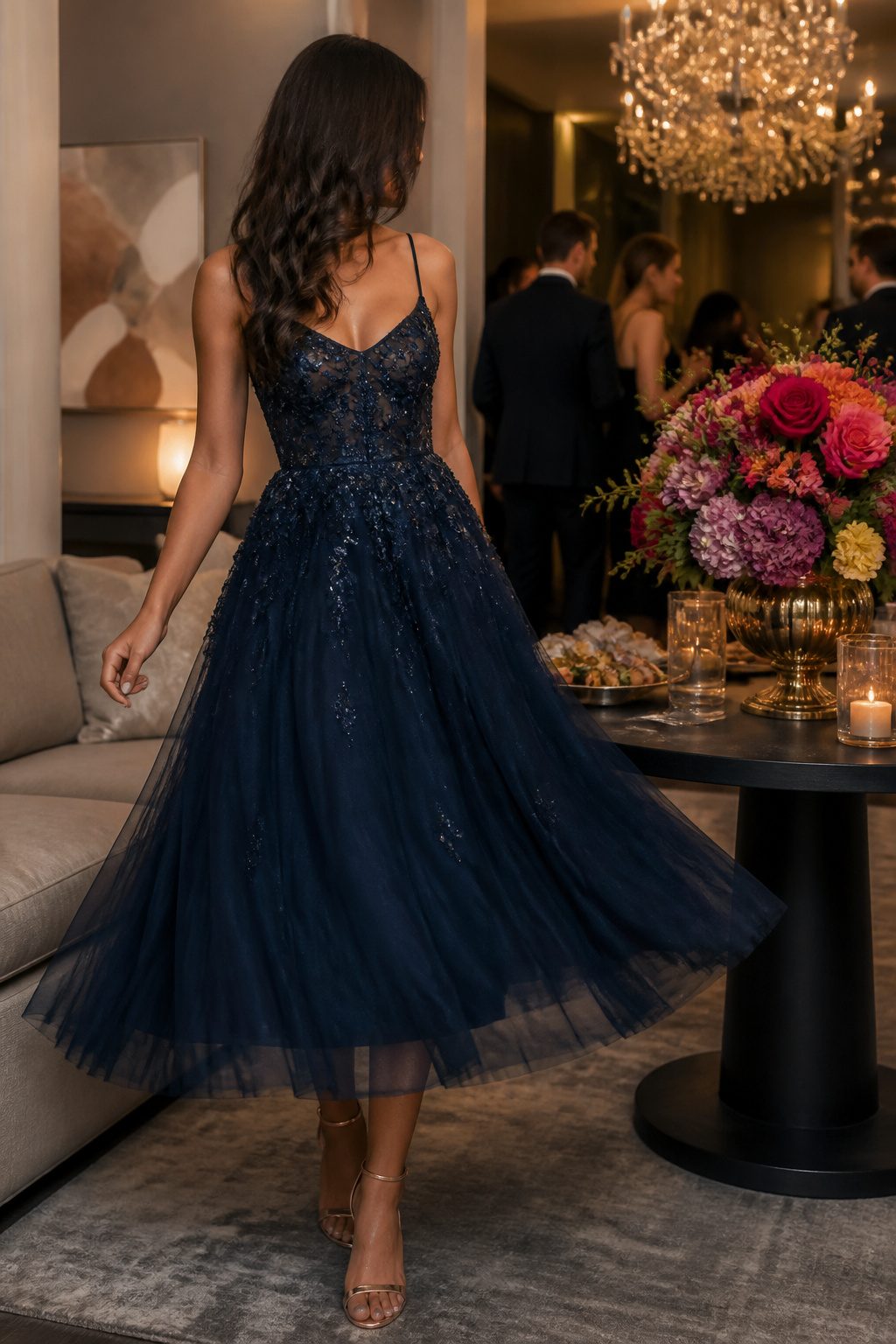 An embellished midi dress worn at a birthday gathering.