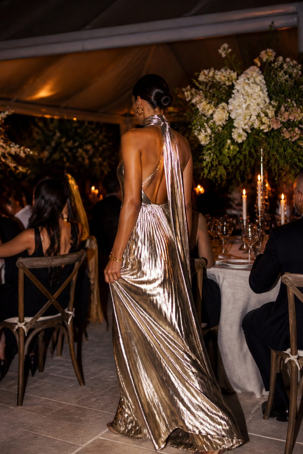 A metallic maxi dress displayed on a model.