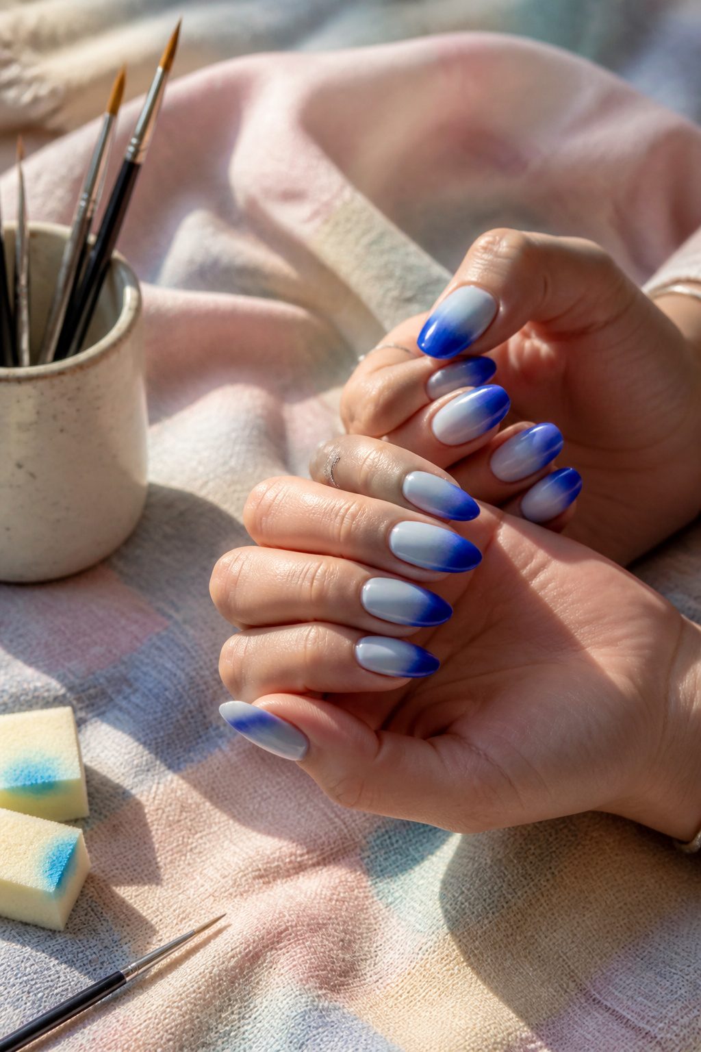 Ombre blue nails transitioning from light blue at the base to cobalt tips.