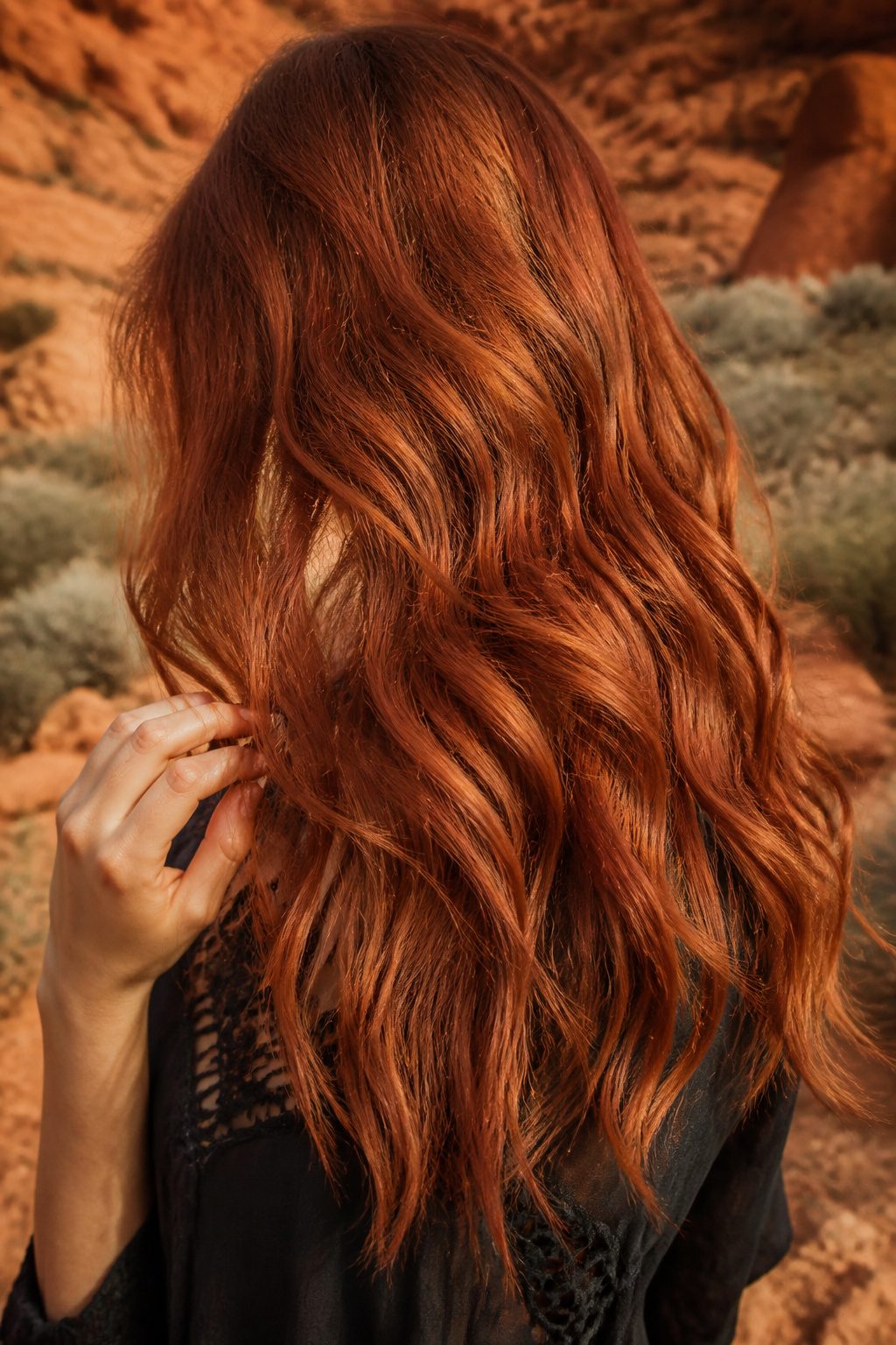 Hair colored in a warm cowboy copper shade.