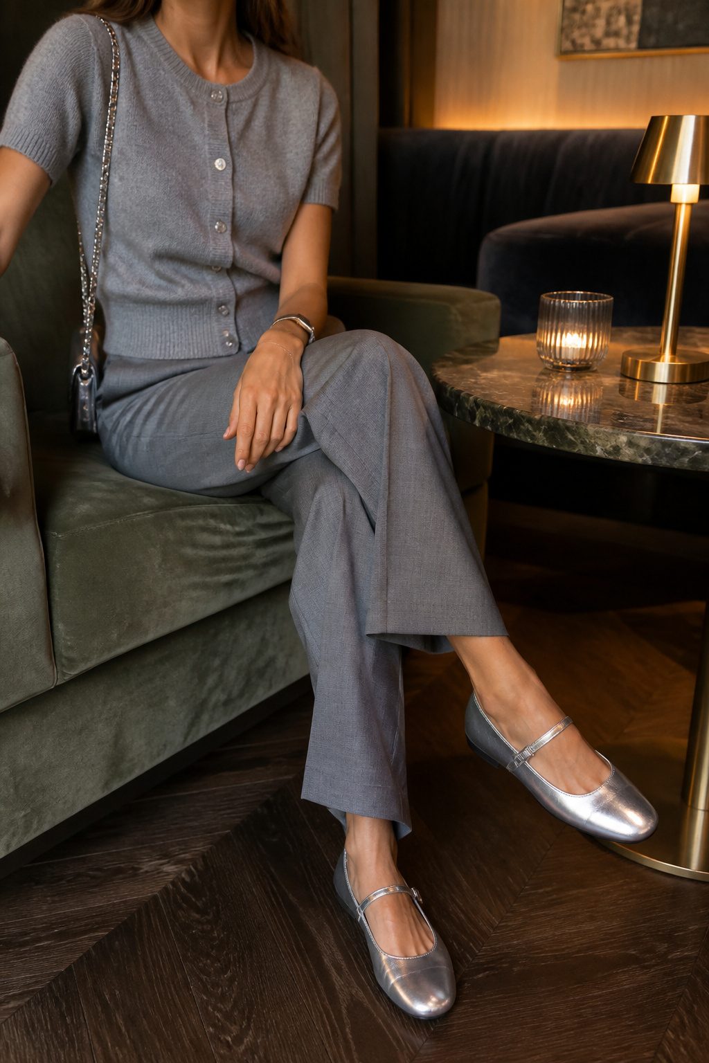 20 Mary Jane Shoes Outfit Ideas for Easy Spring 2026 Style 9 Model in grey trousers and a cardigan showcasing silver flat Mary Janes.