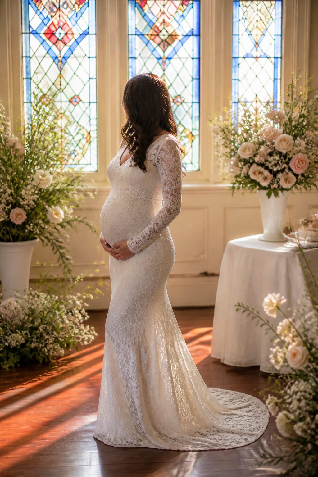 Expectant mother in a lace maternity dress inside a chapel.