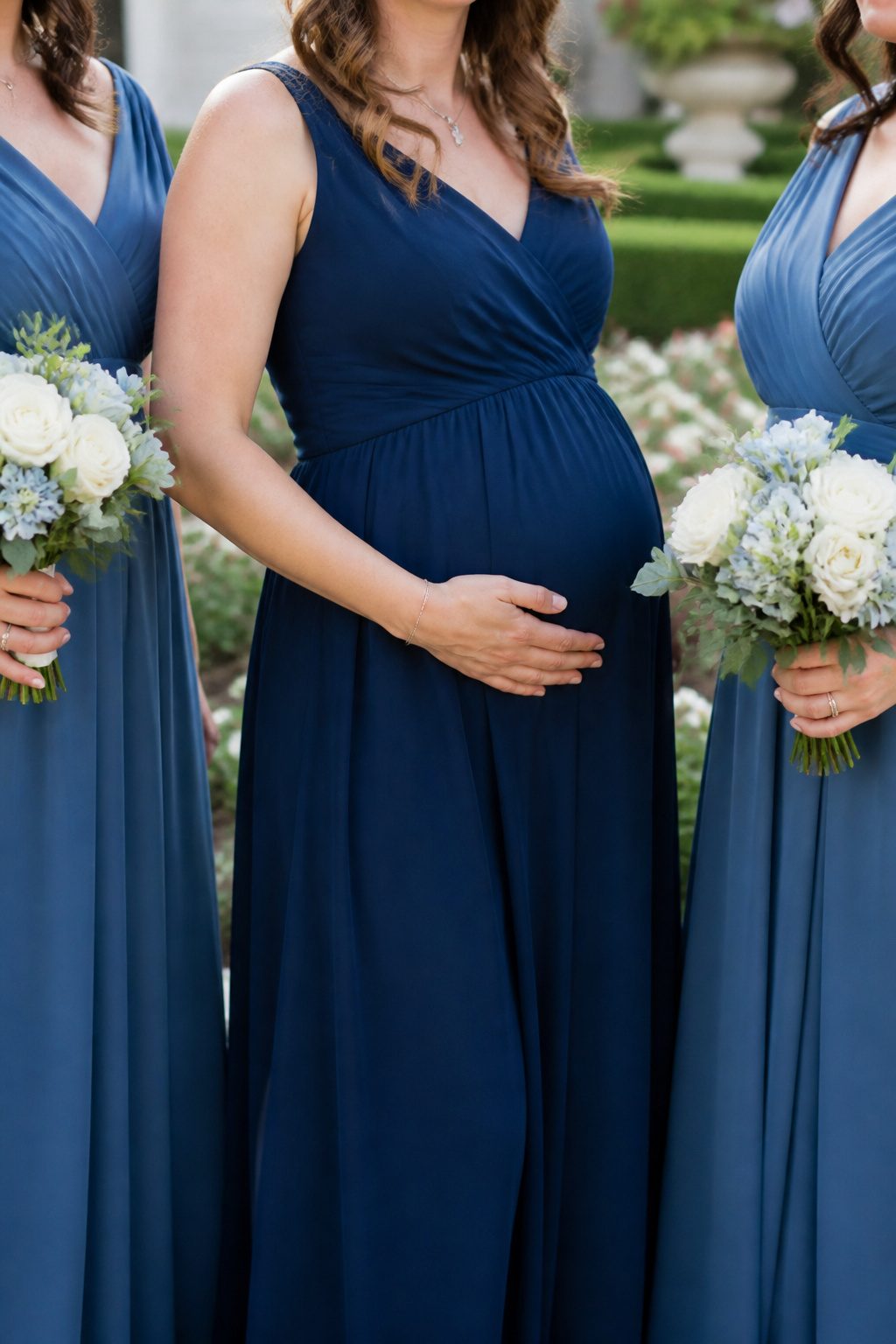 Expectant mother in a nursing bridesmaid dress at a wedding.
