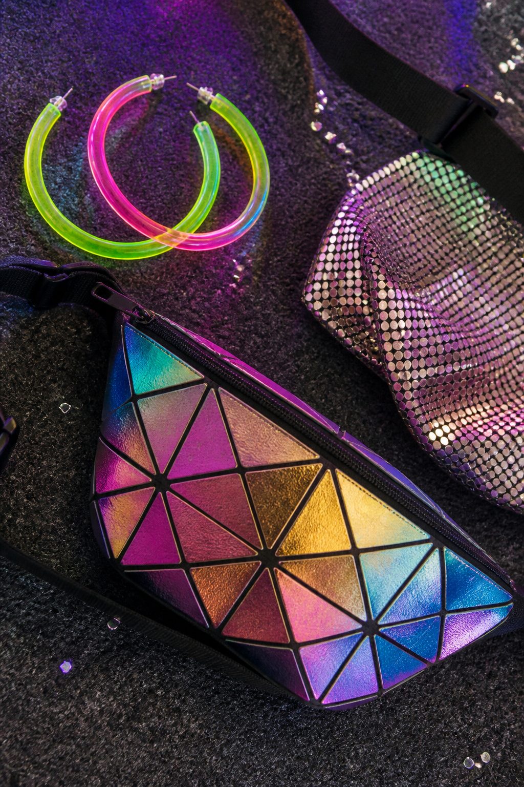 How to Dress for a Pop Concert in 2026 10 A woman accessorizes with jewelry and a crossbody bag at a concert.